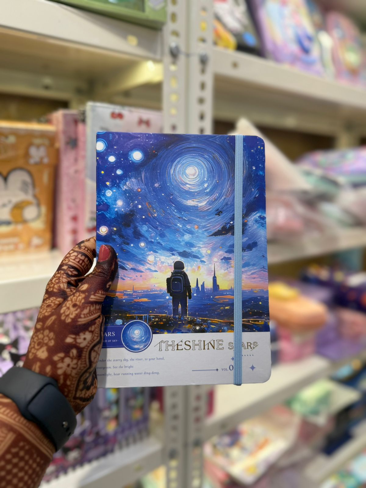 Astronaut themed notebook with starry design
